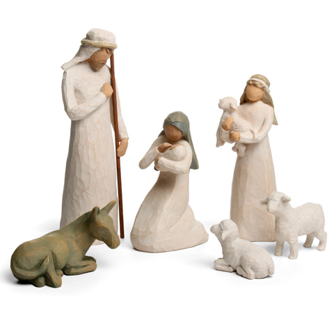 Willow Tree ceramic Nativity set, everyone in white, Mary holding a baby, Joseph or a shepherd with a staff, a youth holding a lamb, a donkey and two sheep. All with cream coloured skin and no facial features.