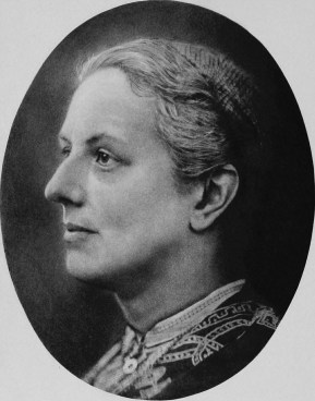 Black and white photo of the head and neck of a white woman looking towards the left of the viewer in an oval frame.