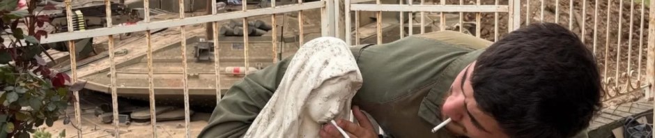 A photo of an IDF soldier holding a cigarette to the mouth of a statue of the Virgin Mary.
